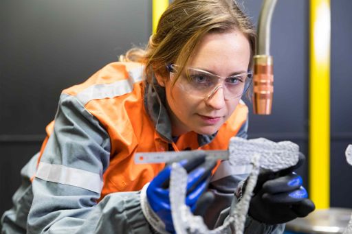 R&D engineer using additive manufacturing equipment.jpg